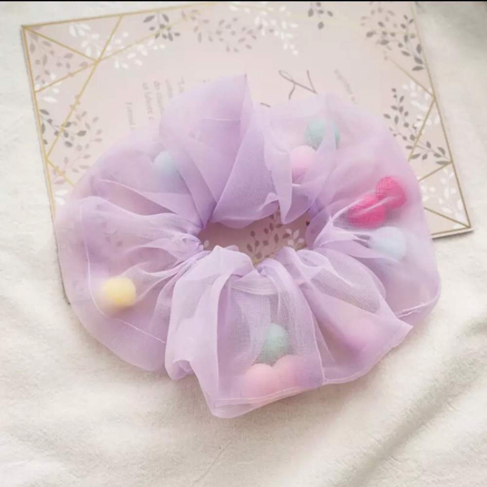Oversized purple pom pom scrunchie